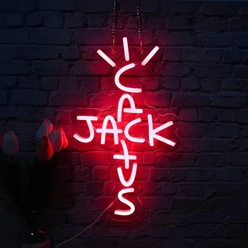 Neon sign with 'C Jack Us' on a brick wall