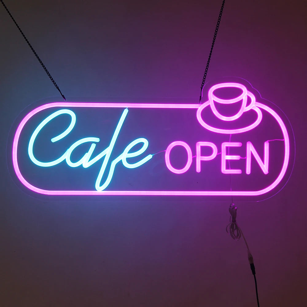 Neon sign indicating 'Cafe Open' with a cup icon on a dark background
