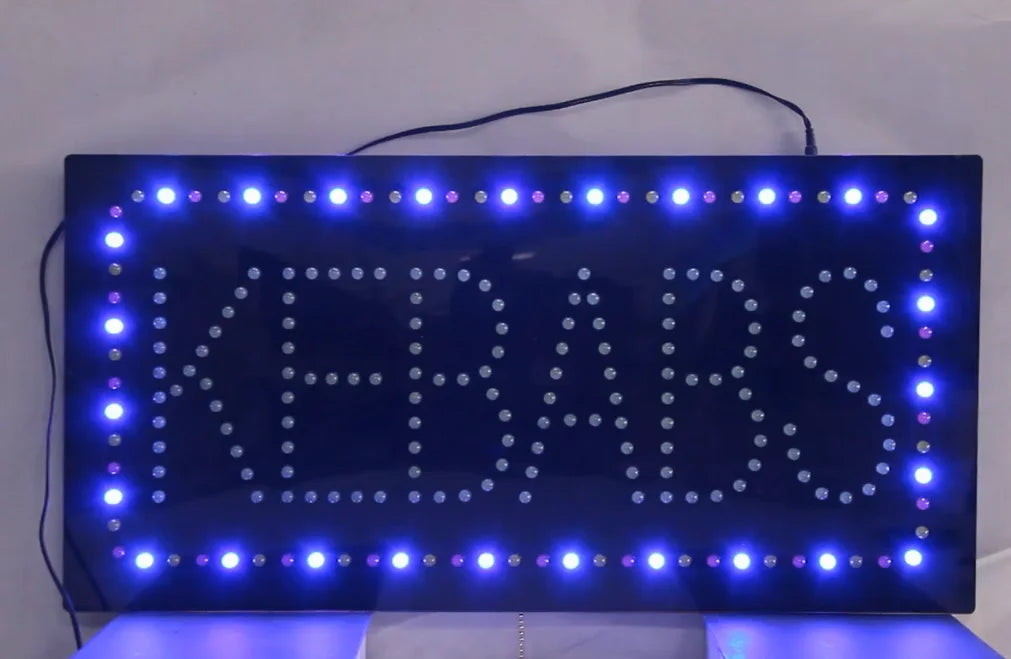 LED sign with 'kebabs' text on a white background
