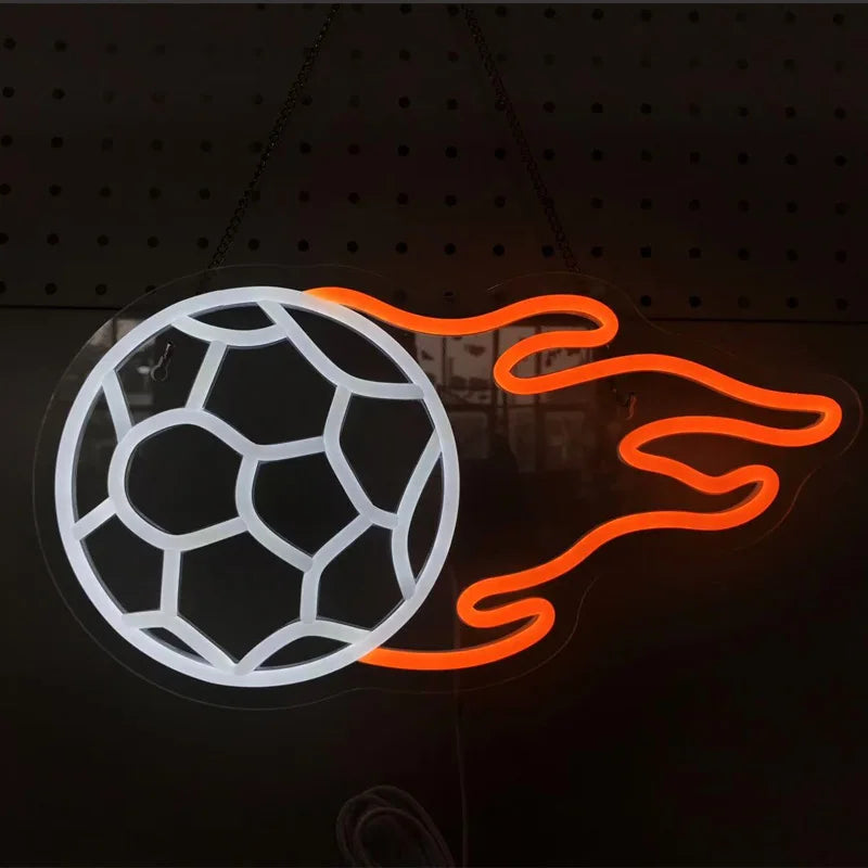 Neon sign of a soccer ball with flames on a dark background