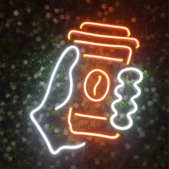 Neon sign of a coffee cup held by a hand against a floral background