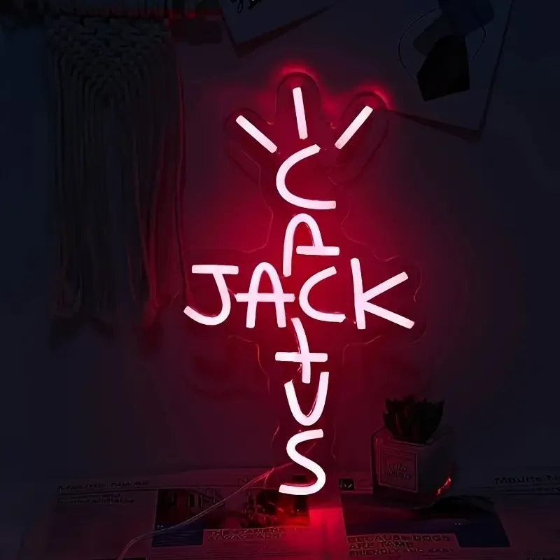 Neon sign with 'C Jack Us' in a dark room