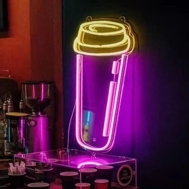 Neon sign of a coffee cup on a dark background