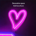 Neon heart-shaped sign on a dark background with text indicating decorative use.