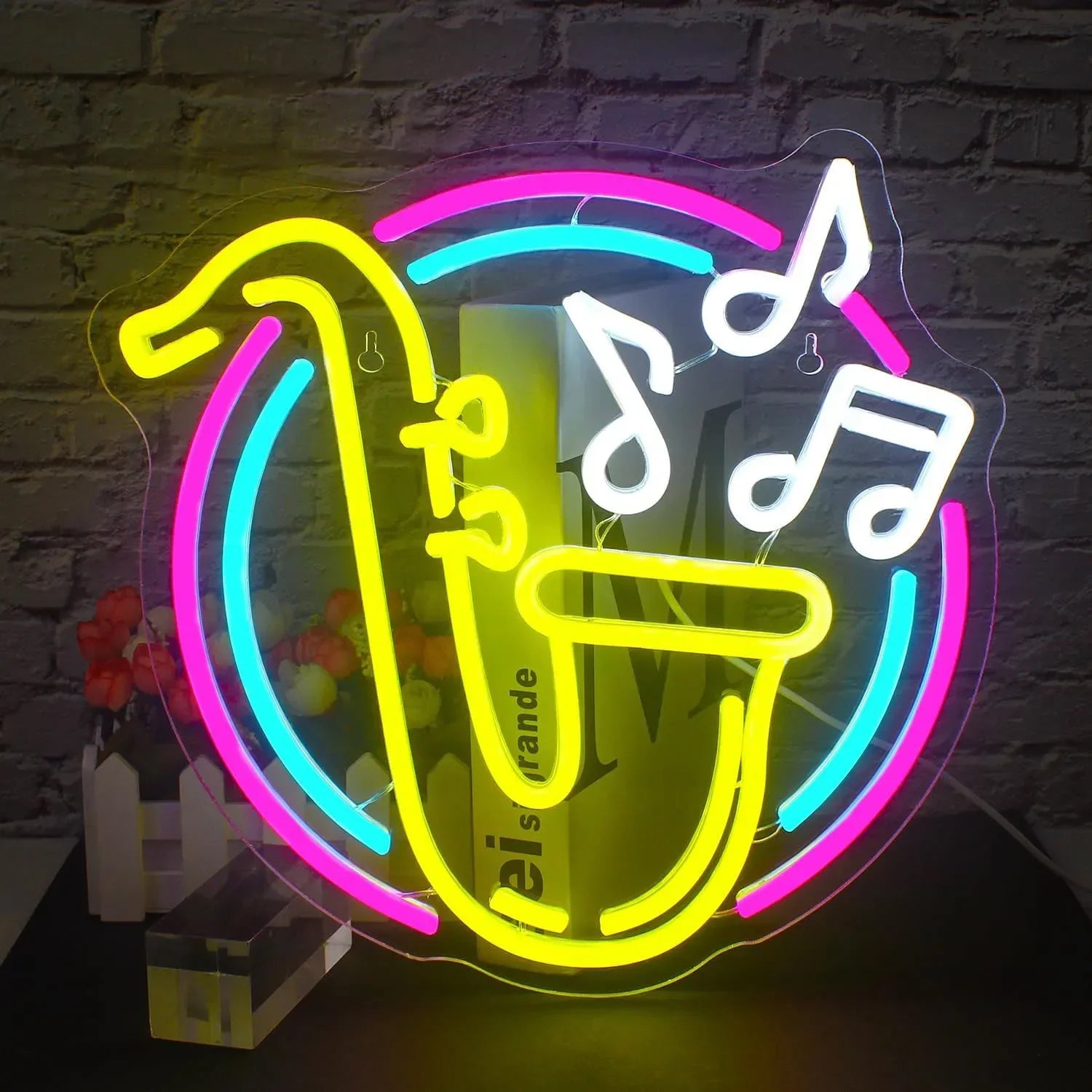 Neon sign of a saxophone with musical notes on a brick wall background