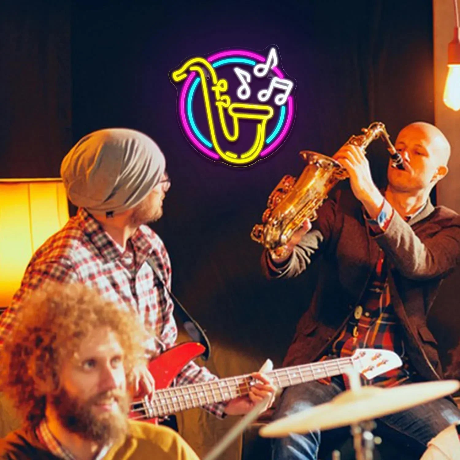 Three musicians playing instruments with a neon sign in the background