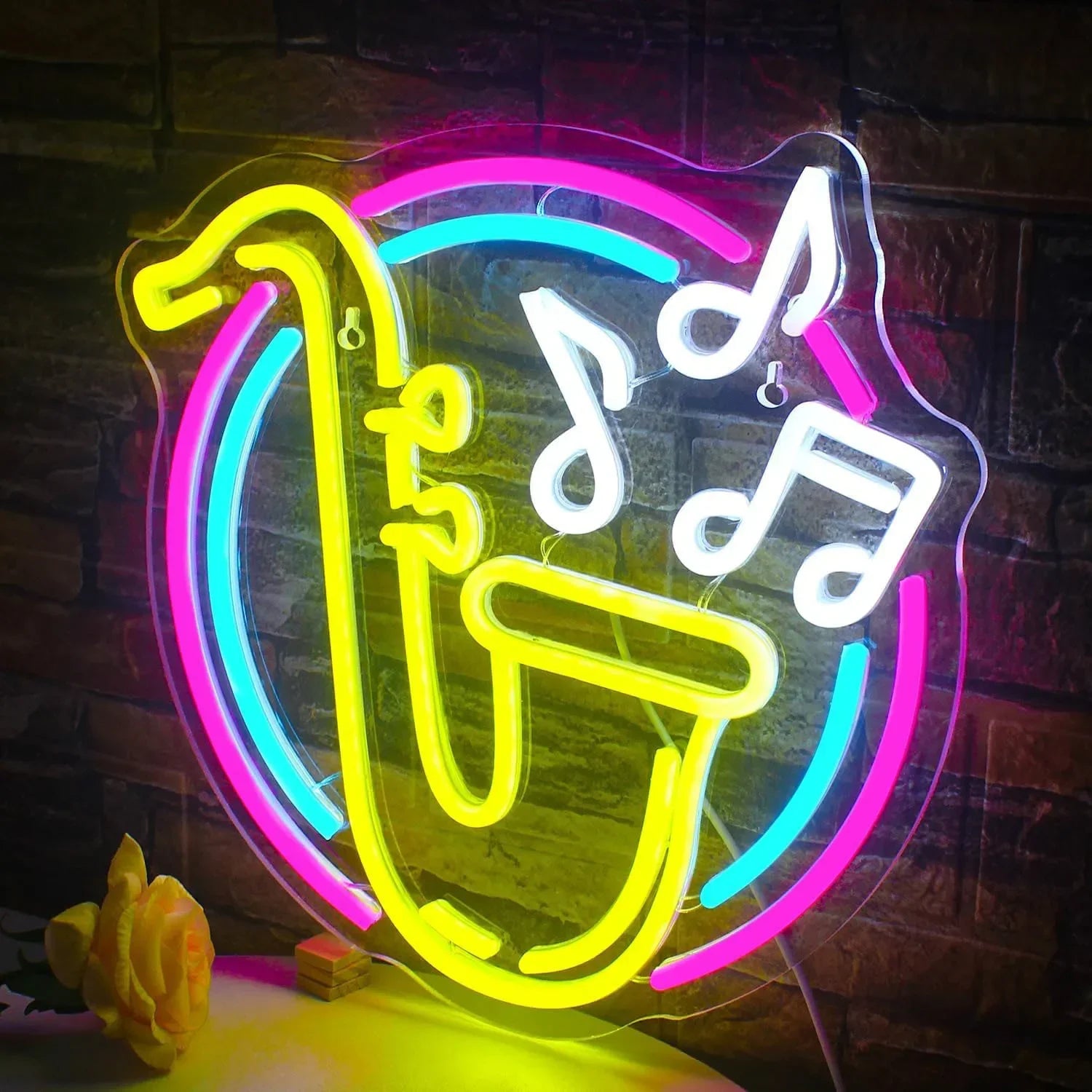 Neon sign with musical notes and a treble clef on a dark background